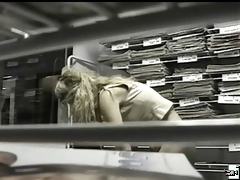 Hot blonde caught on hidden cam topless as she changes her bra right in the office.